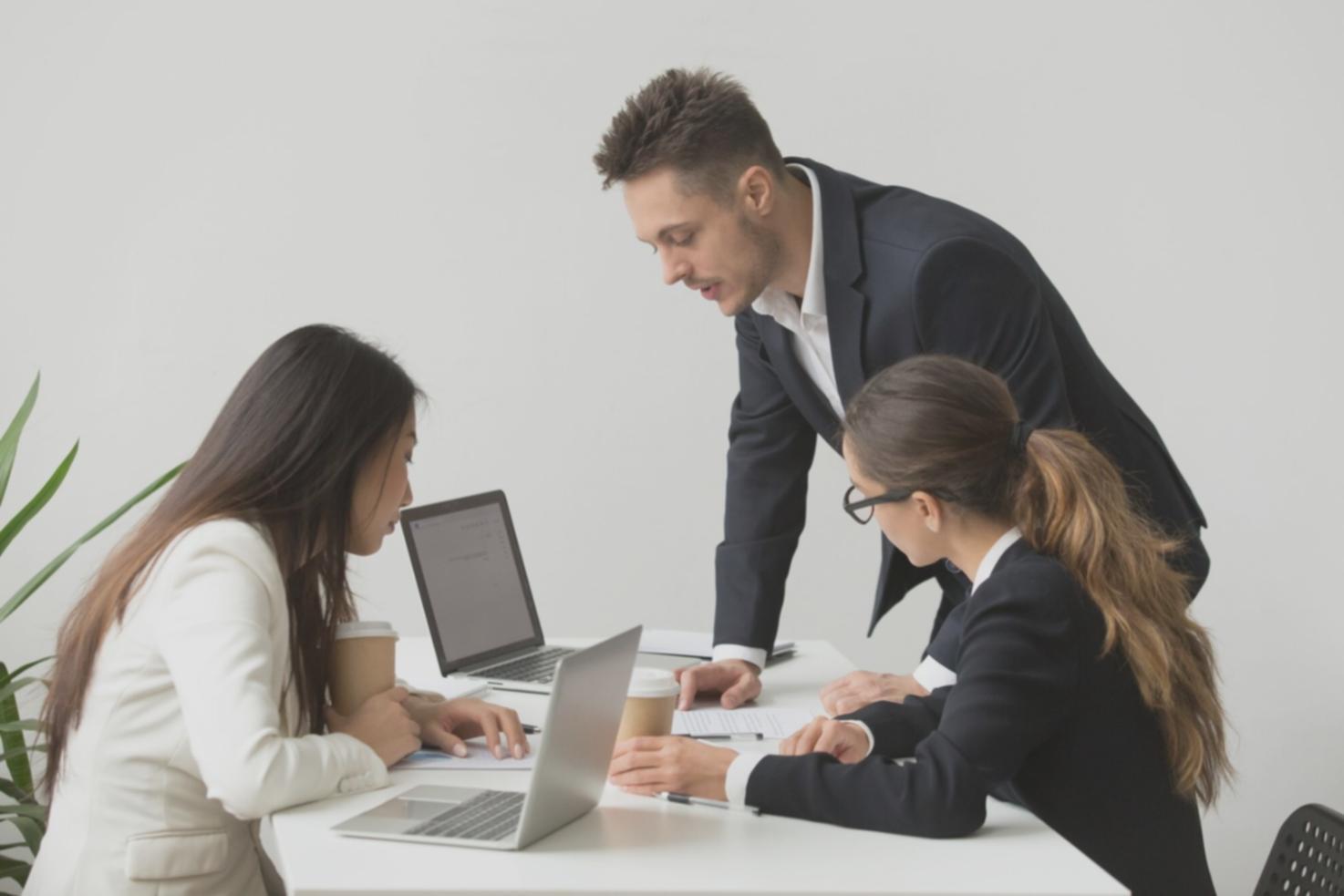 Students working together on financial planning exercises in a collaborative learning environment